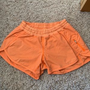 Orange Lululemon shorts